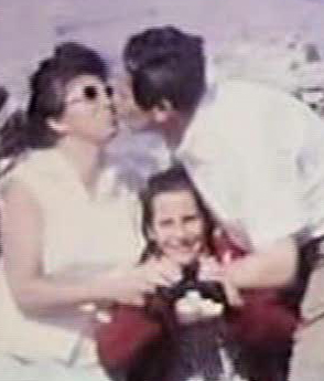 Between my parents kissing