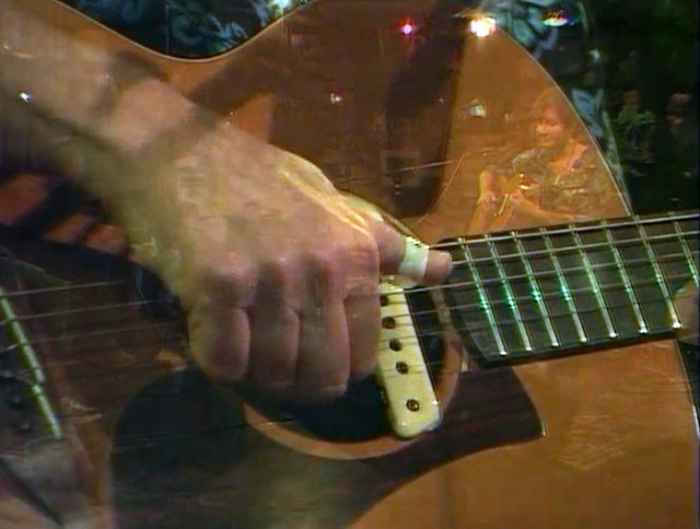 This image is from a video of one of my performances at Kulak’s Woodshed. Sometimes the video has images that overlap, and I can see myself playing in the refection.