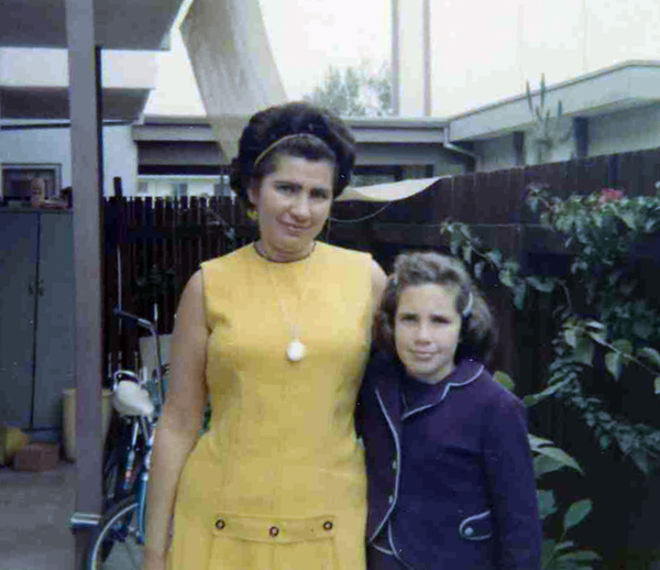 This picture of my mother and I was taken outside the coop where I am now living.