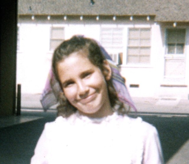 The carport where this picture was taken looks exactly the same. Even with my funny smile in this picture, I remember being a very happy child. I think I’m about 8 years old in this picture.