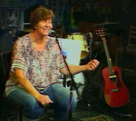 I'm taking a break from performing until my eyes improve. Here I am courageously singing without my guitar!