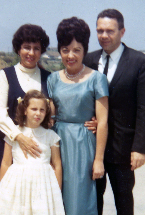 In this picture, I’m with my parents and Susan’s mother is in the middle. I hated being dressed up, so maybe that's why I'm not smiling!