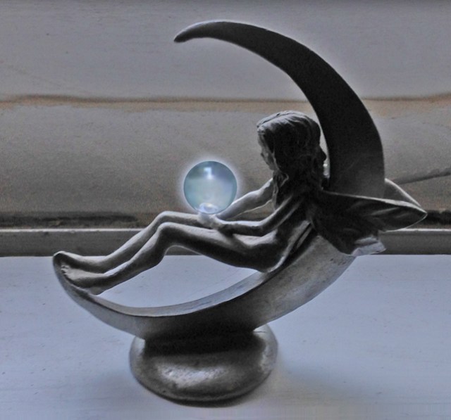 My voice teacher, Kimberly has a beautiful collection of fairy sculptures. I added the crystal ball using the magic of Photoshop.