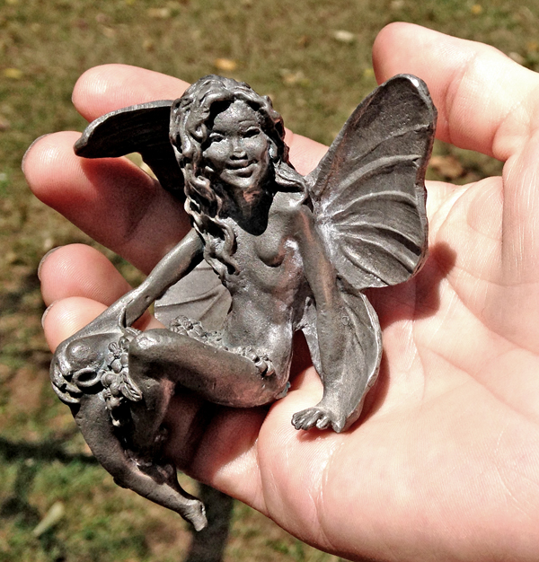 My voice teacher, Kimberly is holding one of her beautiful fairy sculptures. I consider them all to be images for Melody, my inspirational muse.