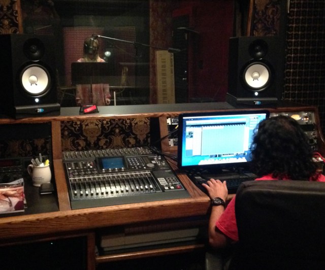 Darrin is on the right and Kimberly is on the other side of the glass.