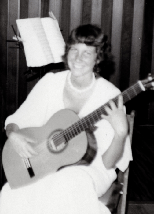 That’s me playing my old classical guitar at the age of 17! Below is that same guitar in my daughter’s hands.