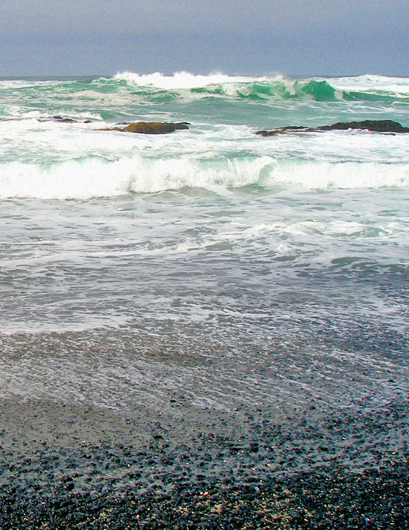 I definitely see glittering pebbles and a watercolor sky with this photo taken at Yaquina Beach in Oregon.