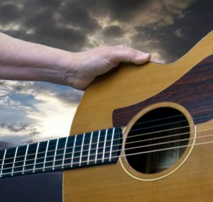 Guitar, hand and sky